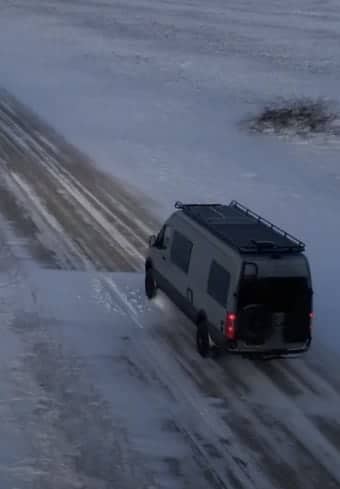 Medical van parked on a snow-covered backcountry road